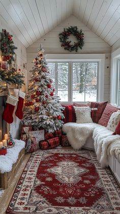 a living room decorated for christmas with red and white decorations on the tree, fireplace, and rug