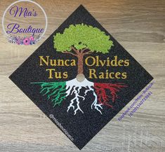 a black cap with the words nunca divides, tus races and a tree on it