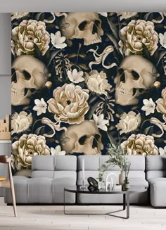 a living room filled with furniture and a large wallpaper covered in skulls, flowers and skulls