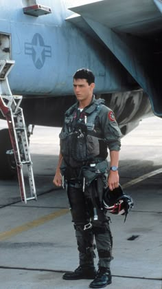 a man standing in front of an airplane