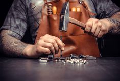 a man holding a knife and some keys