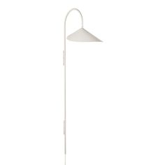 a white floor lamp on a white background with the light turned off and dimming