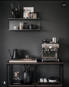 a coffee bar with two shelves above it and various items on the shelf below them