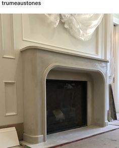 the fireplace is being painted white and ready to be installed