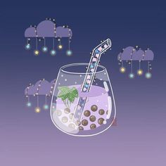 a glass filled with purple liquid and chocolate covered candies on top of it, surrounded by stars