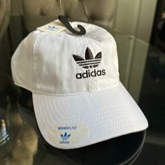 Brand New, Never Worn, White Womens Fit Hat Adidas Hats For Summer Streetwear, Trendy White Hat For Streetwear, Trendy White Hats For Streetwear, Trendy White Streetwear Hat, White Hats For Spring Streetwear, Adidas Cotton Hat With Curved Brim, Adidas Cotton Hats With Curved Brim, Adidas Casual Summer Hats, Trendy White Cotton Baseball Cap