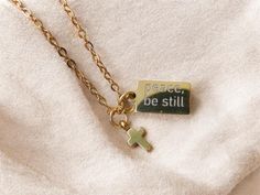 Peace, Be Still Mark 4:39 Engraved necklace christian necklace, adult baptism gift, Jesus necklace confirmation gift christian jewelry ★ STORY ★ When you purchase from our shop, you buy from a true believer. For every product purchase, 10% of this shop's profit goes to expanding, working, and helping the Kingdom. Please read the 'About' section to find out more. ★ MATERIAL ★ ♡ The Engraved tag is made of surgical stainless steel in silver and gold. It is waterproof, tarnish-proof, and hypoallergenic. ♡ The words are engraved, not just printed on the surface, which will fade over use. ★ SPECS ★ ♡ Optional additional tiny cross ♡ Chain type: dainty roll chain 🤍tag size: 13mm X 8mm X 1.2mm  ♡ Chain length:  40cm + 5cm (16 - 18")  ♡ Clasp: Lobster Claw ★ PACKAGING ★ ♡ It will come in a compli Dainty Christian Jewelry, Engraved Cross Charm Necklace Gift, Dainty Christian Necklace, Engraved Cross Pendant Necklace For Baptism, Christian Jewelry Necklaces, Peace Be Still, Adult Baptism Gifts, Adult Baptism, True Believer