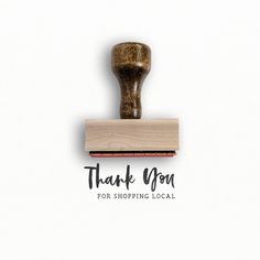 a rubber stamp with the words thank you written on it