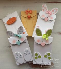 three small cards with bunny ears and bows on them, one in the shape of an envelope