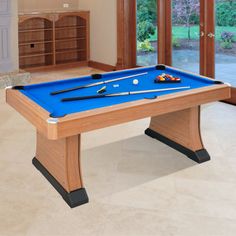 a pool table in the middle of a living room