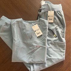 Top: Catrina One Pocket Xxs Bottoms: Clara Jogger Xs Nwts, Didn’t Fit Right And Forgot To Return In Time. Dusty Blue Scrub Color Is No Longer Sold!! Figs Scrubs Outfit, Fig Scrubs, Nursing School Inspiration, Surviving Summer, Dental Scrubs, Nurse Scrubs, Bday Wishlist, Ultrasound Tech, Cute Scrubs