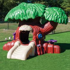 a large inflatable tree with a slide