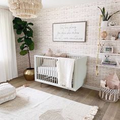 a baby's room with a white crib in the corner