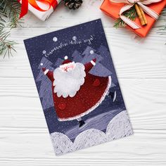 a christmas card with a santa clause on it