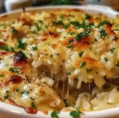 a casserole dish with chicken, cheese and parmesan