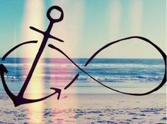 an anchor is drawn in the sand at the beach