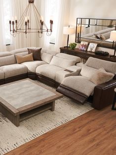 a living room with a sectional couch and coffee table