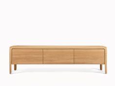 the sideboard is made from wood and has three drawers