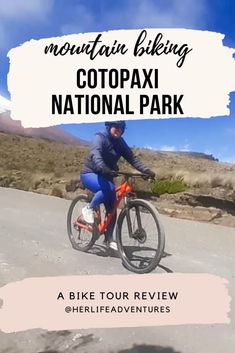 a man riding a bike down a road with the words mountain biking cotpaxi national park