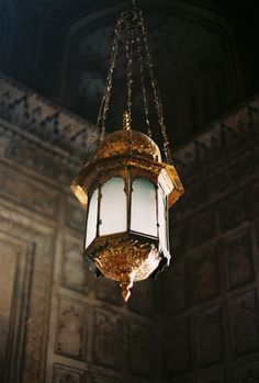 a chandelier hanging from the ceiling in a room