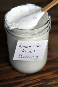 homemade ranch dressing in a jar with a wooden spoon