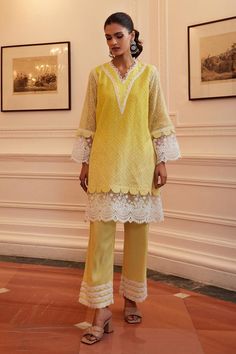 Yellow kurta with thread embroidery in geometric pattern and lace embellished scallop border. Paired with pant. Components: 2 Pattern: Embroidery Type Of Work: Thread, geometric Neckline: V neck Sleeve Type: Full sleeves Fabric: Cotton Chanderi Color: Yellow Other Details:  Length: Kurta: 36 inches Pant: 38 inches Sleeves: 22 inches Occasion: Mehendi and Haldi - Aza Fashions Yellow Cotton Suit, Patch Work Kurti Designs Latest, Cotton Suit Designs, Full Sleeves Design, Yellow Kurta, Scallop Border, Yellow Suit, Coord Set, A Line Kurta