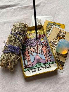 an image of the lovers tarot cards and incense