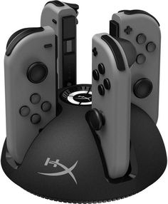 three video game controllers sitting on top of each other