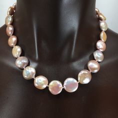 These coin pearls are special! They are solid nacre since they were tissue nucleated. They have not been bleached, so they are a soft pink/cream color and are particularly lustrous. You could wear these for the wedding and then keep wearing them! Looks great with jeans or in the office, or for the opera, and simple enough for everyday wear since it is really a neutral color. They are knotted on silk and finished with my signature beads and a handsome clasp in sterling silver. They will come pack Luxury Round Mother Of Pearl Necklace, Pink Pearl Necklace With High Luster, High Luster Pink Pearl Necklace, Formal Round Mother Of Pearl Necklace, Formal Pink Round Pearl Necklace, Pink High Luster Round Pearl Necklace, Pink High Luster Pearl Necklace, Luxury Pink Pearl Necklace For Wedding, Pink Round Pearl Necklace