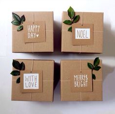 four brown boxes with green leaves on them and the words happy day written in white