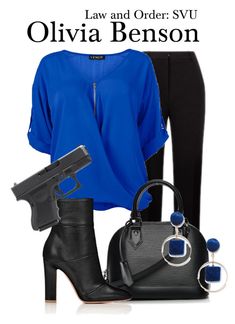 a woman in black pants and blue shirt is wearing high heeled boots with her handbag