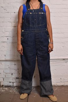 Vintage 1960s/70s Lee Overalls Dark Wash Denim. White topstitching, seven pockets, button fly, straight leg. 100% Cotton  Made in USA Great Vintage Condition  Waist - 33" Hip - 45" Rise - 13" Inseam - 33.5" Vintage Dungarees Outfit, Retro Relaxed Fit Overalls With Pockets, Retro Jeans With Patch Pockets In Medium Wash, Vintage Dark Wash Bottoms With Patch Pockets, Retro Medium Wash Jeans With Patch Pockets, Vintage Fitted Jeans For Workwear, Vintage Relaxed Fit Overalls For Workwear, Fitted Vintage Jeans For Workwear, Vintage Overalls With Relaxed Fit For Workwear