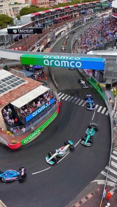 an aerial view of a race track with cars on it