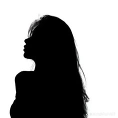 the silhouette of a woman with long hair