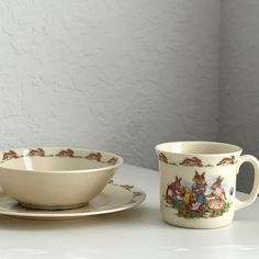 two cups and saucers on a table with white walls in the backround