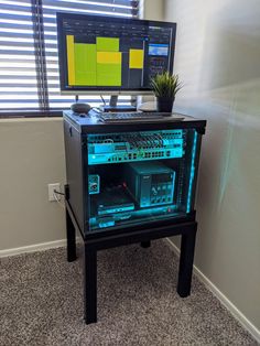 a computer monitor sitting on top of a desk