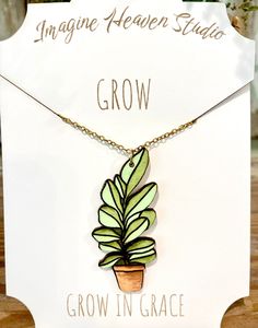 a card with a plant on it and the words grow in grace written above it