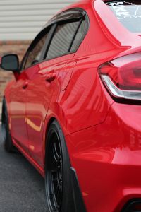 the rear end of a red sports car