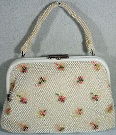 "We are pleased to offer Exclusively to our Etsy Shoppers, this wonderful Vintage Summer Purse dating from the 1960's. The purse measures 10\" wide, 6\" high and 2 1/2\" deep with a 6\" drop and is completely covered in sewn on white beads. Accenting the purse are rectangular insets of clear/silver sewn on beads with embroidered rose buds in the center of each. The handle is held in place by two gold tone bars attached to the gold tone frame, two gold tone balls open the purse. Inside it is full Summer Purses, Beaded Handbag, Beaded Purses, Vintage Summer, White Beads, Embroidery Inspiration, Out Of Style, Rose Buds, Cute Icons