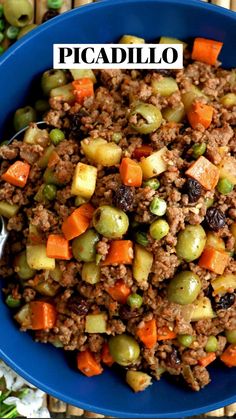 a blue bowl filled with meat and vegetables