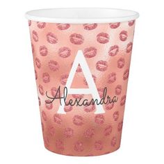 a pink cup with leopard print and the word alexandria on it's front side