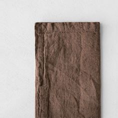 a brown napkin on a white background