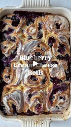 blueberry cream cheese rolls in a baking dish with the words blue berry cream cheese rolls