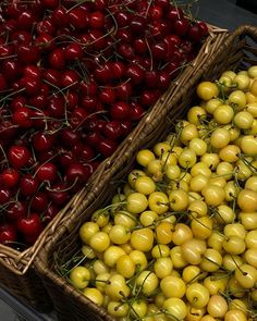 two baskets filled with cherries next to each other