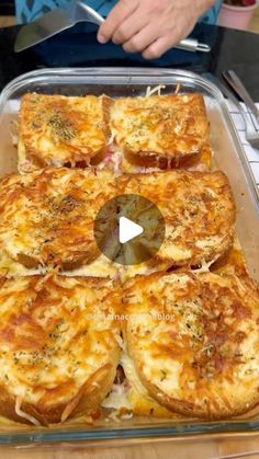 a pan filled with pizza sitting on top of a counter