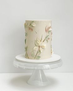 there is a white cake with flowers on it