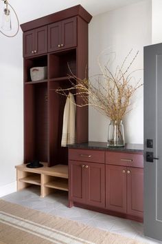 a large wooden cabinet sitting in the middle of a room