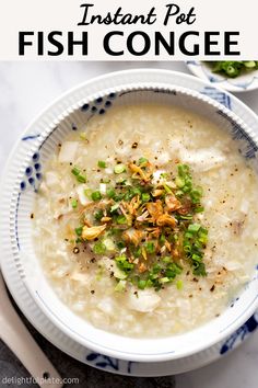 two bowls filled with rice and vegetables on top of a white tablecloth next to spoons