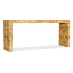 a wooden table with writing on it and a white wall in the backround