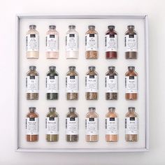 an assortment of spices displayed in a white frame